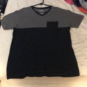 Short sleeve grey and black t-shirt with pocket.